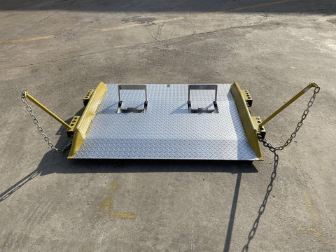 Heavy-duty steel loading dock ramp on warehouse floor
Industrial dock ramp with yellow safety rails
Forklift-ready steel dock board in use
Side view of 15,000 lb steel dock ramp
Loading dock ramp with chain attachment system