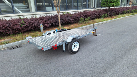 Heavy-duty galvanized 4x8 folding utility trailer with checker plate deck and road-ready tires