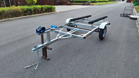 Heavy-duty galvanized 4x8 folding utility trailer with checker plate deck and road-ready tires