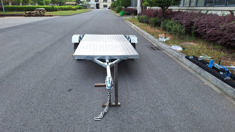 Heavy-duty galvanized 4x8 folding utility trailer with checker plate deck and road-ready tires