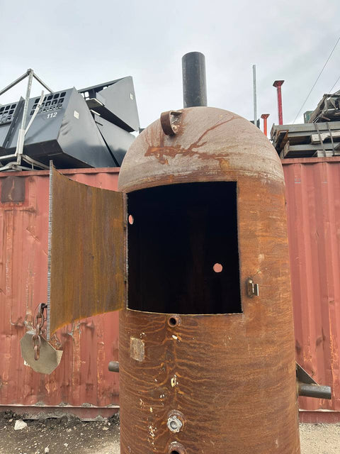 “7.5 ft tall steel garbage incinerator with vent stack”
“Industrial burn drum with hinged loading door”
“outdoor incinerator barrel for yard waste and brush”
“heavy-duty steel burn barrel for farm or construction”
“pre-weathered rust-patina waste disposal drum”