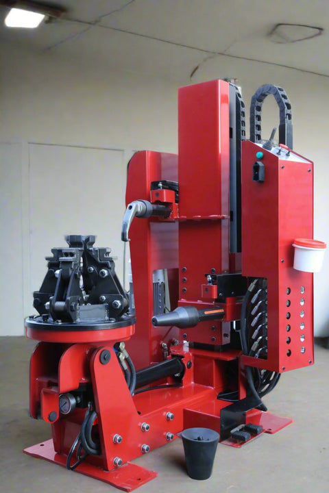 HCB930 vertical tire changer – full unit for semi truck wheels
Heavy-duty tire machine for bus and van wheels with hydraulic clamping
Red semi truck tire changer with control console and lifting arm – Model HCB930