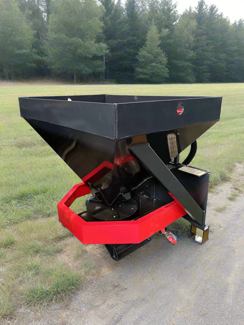 Skid Steer Tilt-N-Scoop Material Spreader front view
Side profile of spreader mounted on skid steer
Hydraulic spreader with sidewalk shield
Top view of hopper and agitator
Spreader attachment in action with sand
