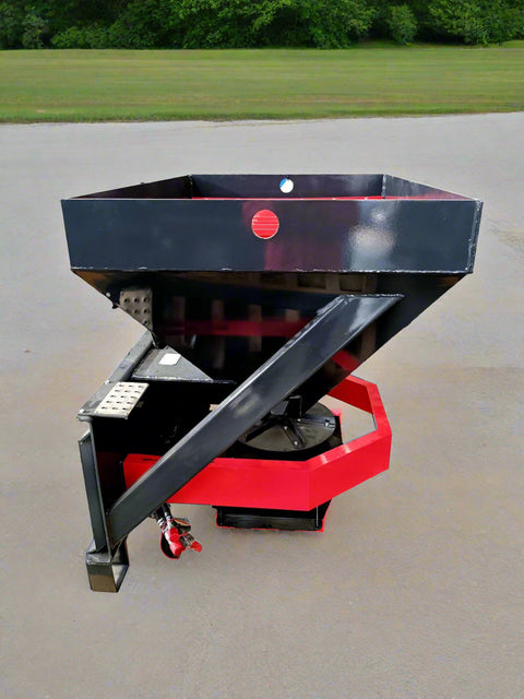 Skid Steer Tilt-N-Scoop Material Spreader front view
Side profile of spreader mounted on skid steer
Hydraulic spreader with sidewalk shield
Top view of hopper and agitator
Spreader attachment in action with sand