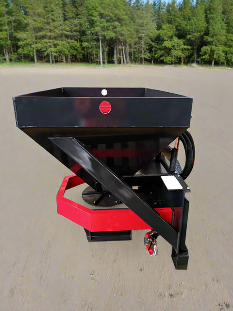 Skid Steer Tilt-N-Scoop Material Spreader front view
Side profile of spreader mounted on skid steer
Hydraulic spreader with sidewalk shield
Top view of hopper and agitator
Spreader attachment in action with sand