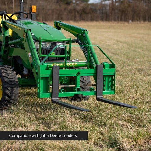 John Deere Euro Global 2-in-1 hay spear and pallet fork combo in use
Front view of the green hay spear attachment
Close-up of pallet fork mount
Forklift-style prongs on John Deere combo attachment
Side view of the detachable hay spear