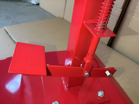 Manual tire changer and spreader stand with red base and swivel platform
Tire changer stand showing adjustable tilt function and tool tray
Manual tire repair stand for light truck tires in auto repair garage