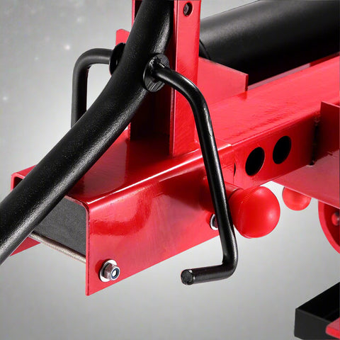 Manual tire changer and spreader stand with red base and swivel platform
Tire changer stand showing adjustable tilt function and tool tray
Manual tire repair stand for light truck tires in auto repair garage