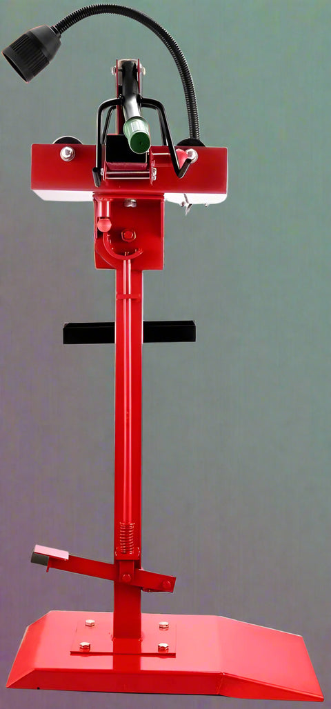 Manual tire changer and spreader stand with red base and swivel platform
Tire changer stand showing adjustable tilt function and tool tray
Manual tire repair stand for light truck tires in auto repair garage