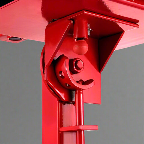 Manual tire changer and spreader stand with red base and swivel platform
Tire changer stand showing adjustable tilt function and tool tray
Manual tire repair stand for light truck tires in auto repair garage