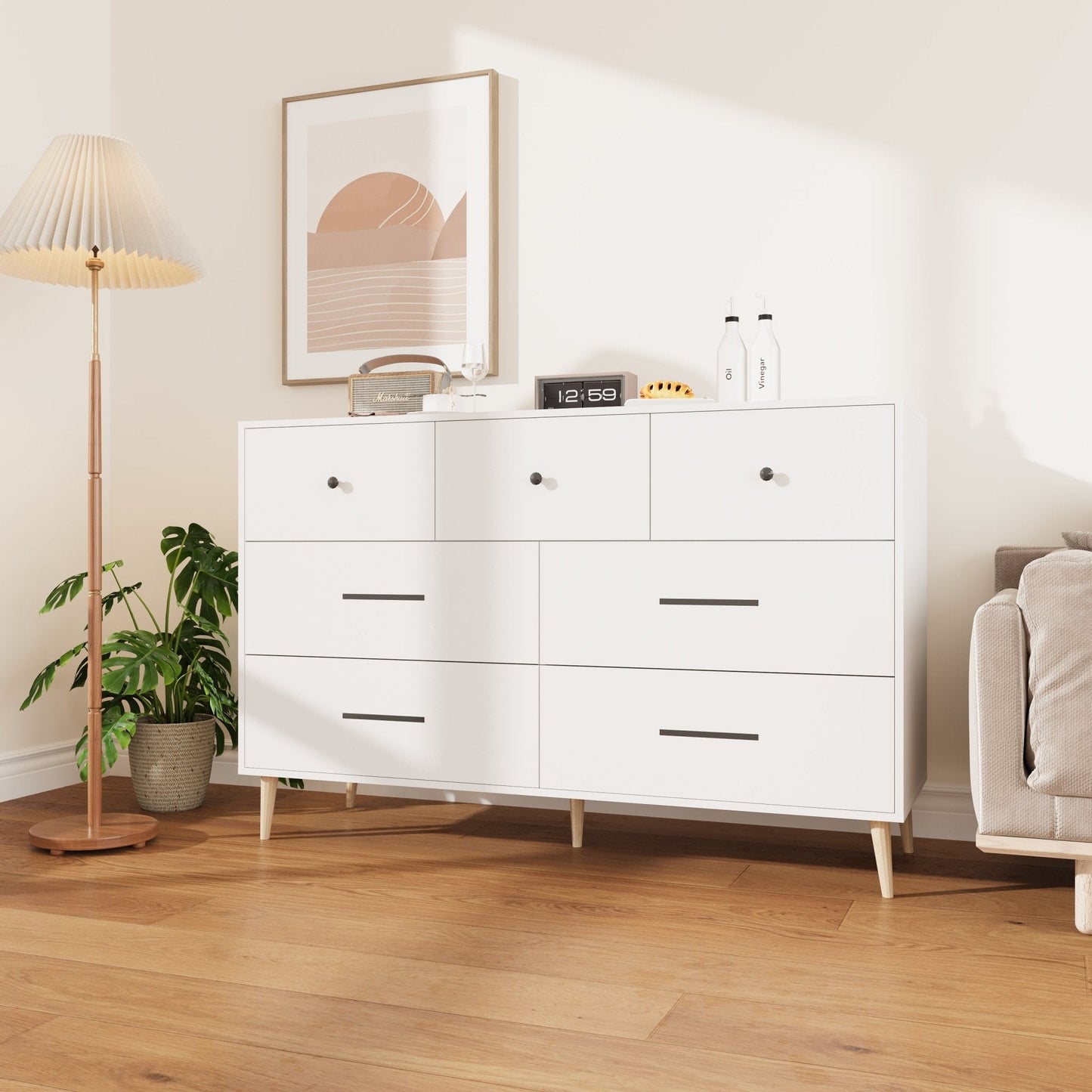 Chestnut 7-Drawer Storage Cabinet in Modern Bedroom Setting
White Modern Dresser with Wooden Legs in Entryway
Close-Up View of Cabinet Drawers and Handles
Chestnut Wood Finish on 7-Drawer Storage Dresser
White 7-Drawer Cabinet with Decorative Plants and Lamp