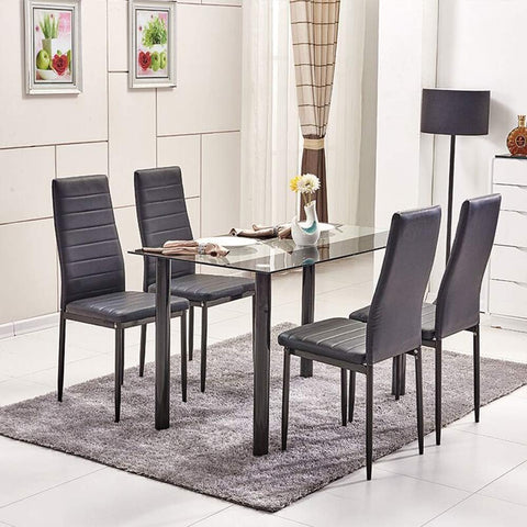Modern black glass dining table with white leather chairs in dining room setting