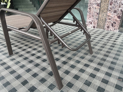 Reclining folding patio lounger chair on the beach
Adjustable sun lounger with breathable Teslin mesh
Close-up of outdoor lounger armrest and frame
Folded outdoor lounge chair ready for storage
Lounger chair beside swimming pool deck