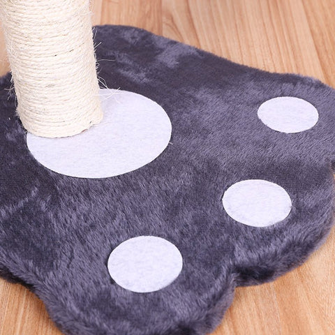 12" paw print cat scratching post with hanging play ball
compact cat tower for kittens with white post and black base
cat scratcher with interactive ball toy
cute cat scratching post with paw-shaped base
indoor kitten play stand for active pets