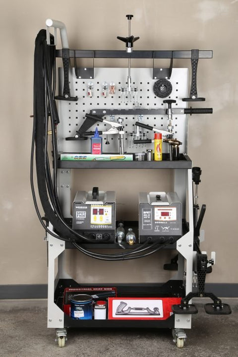 Main view of professional auto body dent welder machine
Welding gun and accessory layout in body shop
Open kit showing stud welder and tools
Slide hammer and puller accessories in case
Operational view of dent repair welder setup