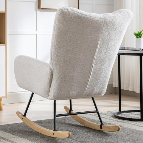 Gray ergonomic glider rocking chair for nursery with wood base
White soft upholstered rocking chair with curved wood base
Rocking chair for the living room with ergonomic support and plush padding