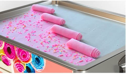 “Rolled ice cream machine with colorful ingredients”
“Stainless steel commercial ice cream maker on display”
“180W rolled ice cream maker with side ventilation holes”
“Rolled ice cream prep on freezing plate”
“Ice cream rolls being made with spatula”