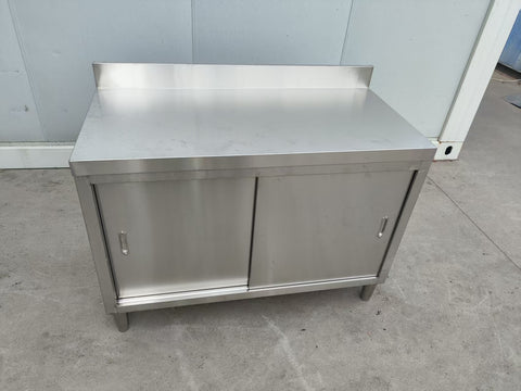 Stainless steel workbench with sliding doors front view
Restaurant prep table with built-in storage
Commercial kitchen stainless steel workbench
Side view of sliding door stainless work table
Heavy-duty garage workbench with stainless cabinet