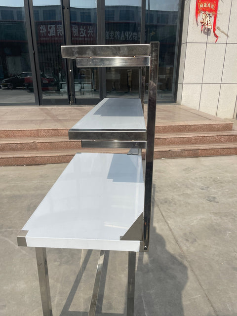 Stainless steel prep table with integrated overshelf – front view
Commercial-grade kitchen work table with upper storage
1200mm stainless prep station with dual-tier design
Heavy-duty stainless kitchen table – side angle
Restaurant overshelf prep table – silver finish