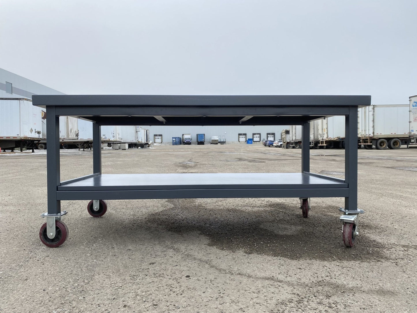 Steel Rolling Tool Table with Two Layers and Locking Casters – TC025M
Mobile Workbench with Gray Finish in Garage Setup
Heavy-Duty 2-Tier Steel Workstation for Industrial Use
Tool Table with Smooth-Rolling Wheels and Shelf Storage
Front Angle of Steel Workbench with Lower Shelf and Locking Wheels
Industrial Workshop Setup Featuring TC025M Rolling Bench
Side View of Assembled Rolling Work Table in Gray Metal