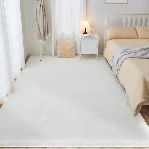 White fluffy area rug in modern living room
Gray soft rug under coffee table in cozy interior
Close-up of rug texture and anti-skid bottom
Hand touching plush surface of bedroom rug
Stylish white rug under sofa set with natural light