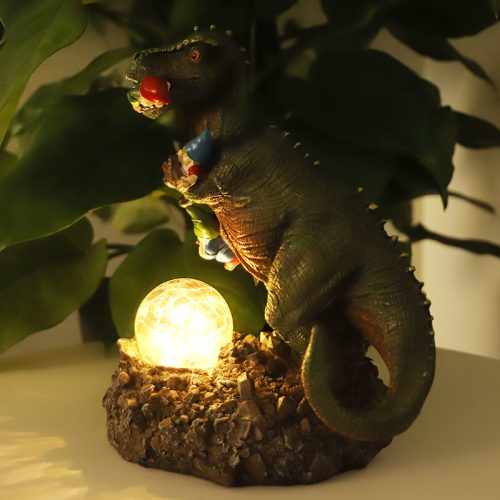 Funny dinosaur garden gnome massacre solar LED light
T-Rex devouring gnomes solar statue for garden decor
Outdoor dinosaur light with solar-powered LED illumination