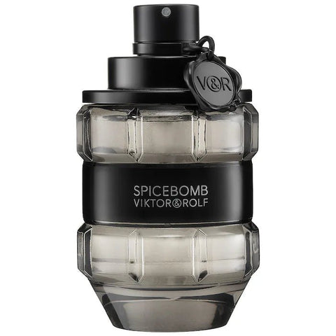 Spicebomb cologne bottle next to packaging
3.04 oz Viktor&Rolf men’s fragrance close-up
Dark masculine cologne with spice and wood background