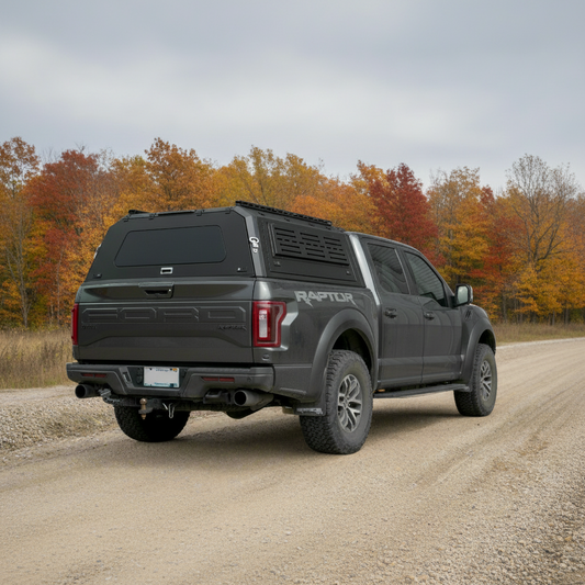 Side view of heavy-duty steel truck topper on black pickup
Modular canopy with open gullwing side door
Lockable utility cap rear view
Installation components of modular truck canopy
Steel topper installed on full-size pickup truck