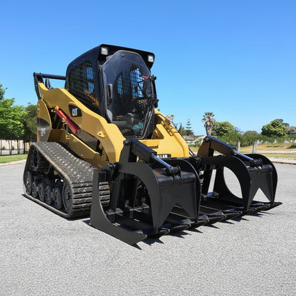72" skid steer grapple bucket front view

84" rock grapple on skid steer in action

Close-up of dual hydraulic cylinder and hose setup

Heavy-duty tines and steel frame

Grapple holding large rocks and debris


