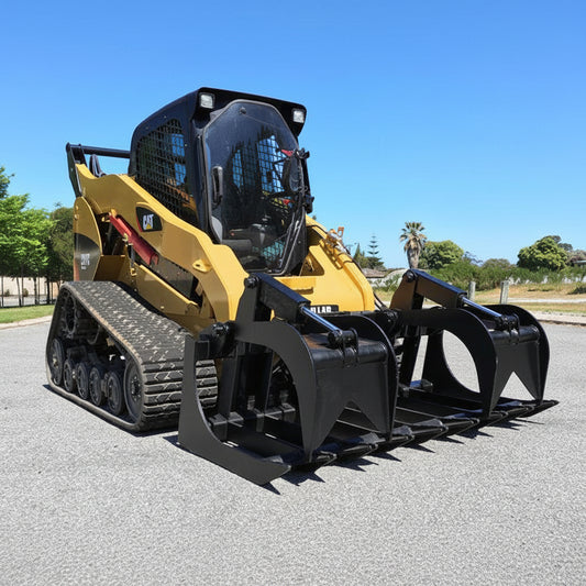 72" skid steer grapple bucket front view

84" rock grapple on skid steer in action

Close-up of dual hydraulic cylinder and hose setup

Heavy-duty tines and steel frame

Grapple holding large rocks and debris

