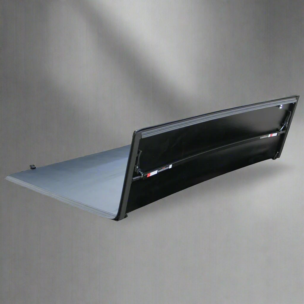Tri-fold soft tonneau cover installed on Ford F-150 6.5 ft bed
Roll-up tonneau cover for 2009–2020 Ford truck bed
Weatherproof vinyl truck bed cover with clamp system
Tonneau cover folded up showing bed access
Side view of tri-fold tonneau cover on Ford F-150