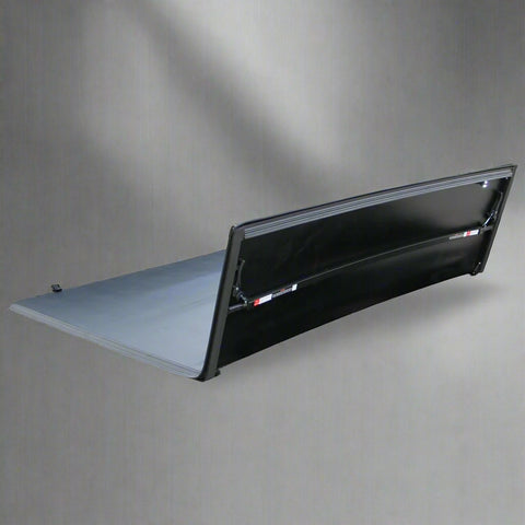 Tri-fold soft tonneau cover installed on Ford F-150 6.5 ft bed
Roll-up tonneau cover for 2009–2020 Ford truck bed
Weatherproof vinyl truck bed cover with clamp system
Tonneau cover folded up showing bed access
Side view of tri-fold tonneau cover on Ford F-150