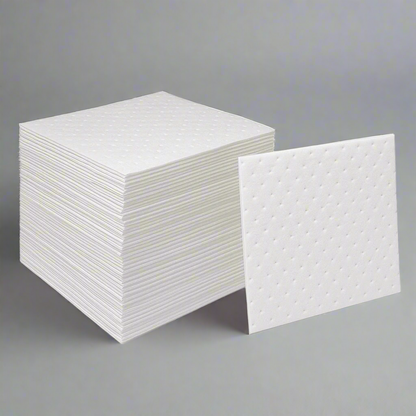Compact stack of 100 oil absorbent pads – industrial fuel spill cleanup