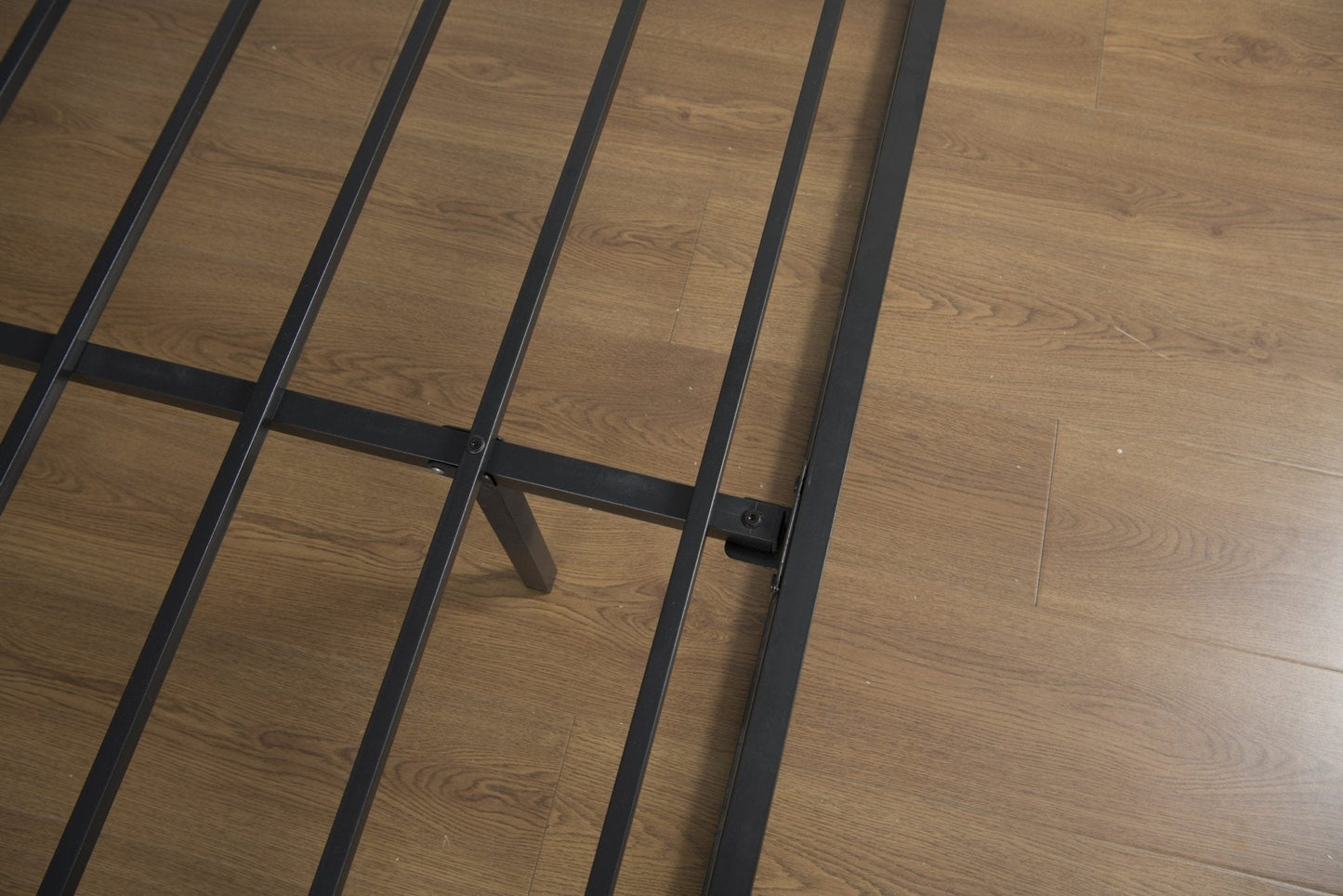 Top view of full-size platform bed frame with strong metal slats