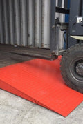 Overview of container ramp connected to 40ft sea container in warehouse