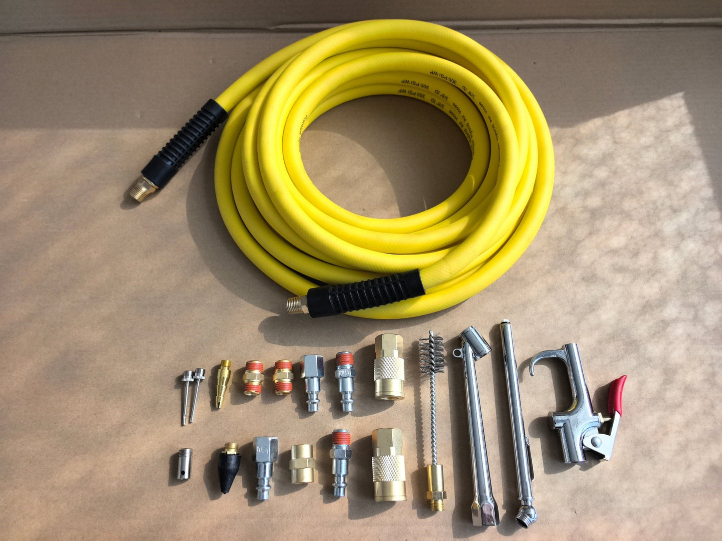 19 - Piece Air Compressor Accessory Kit with 3/8" × 25 ft Hybrid Hose, Quick Connect Fittings, Blow Gun & Tire Gauge – 19382514 - with | Sold by Uncle Wiener's Wholesale