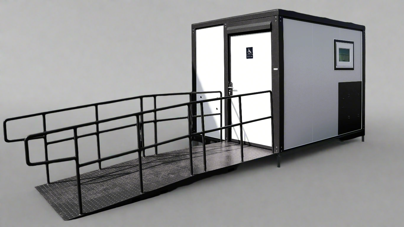 7-foot ADA-compliant portable restroom with ramp in outdoor setting
Inside view of wheelchair-accessible bathroom interior
Front door of handicap bathroom unit with ramp
Washbasin and toilet setup in ADA portable unit
Side view of accessible bathroom setup