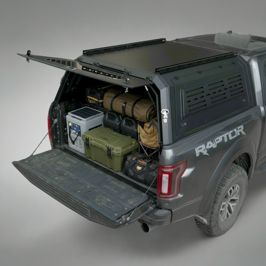 Side view of heavy-duty steel truck topper on black pickup
Modular canopy with open gullwing side door
Lockable utility cap rear view
Installation components of modular truck canopy
Steel topper installed on full-size pickup truck