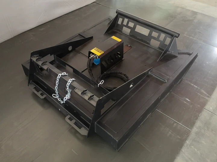 72 inch skid steer brush mower angled view

Underside of heavy-duty cutting blades

66 inch mower installed on skid steer

Skid steer clearing brush and saplings

Blade set and replacement part display