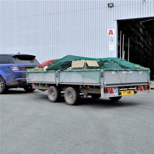 Heavy-Duty Cargo Net Securing Trailer Load – 12x8 ft with Hooks

Green Waste Load Covered by Bungee Truck Net in Trailer

Cargo Net Spread Over Pickup Truck with Reinforced Hooks

Close-Up of Nylon Cargo Net Mesh and Hook Connection

Rolled Heavy-Duty Load Net with Hook Attachments Displayed