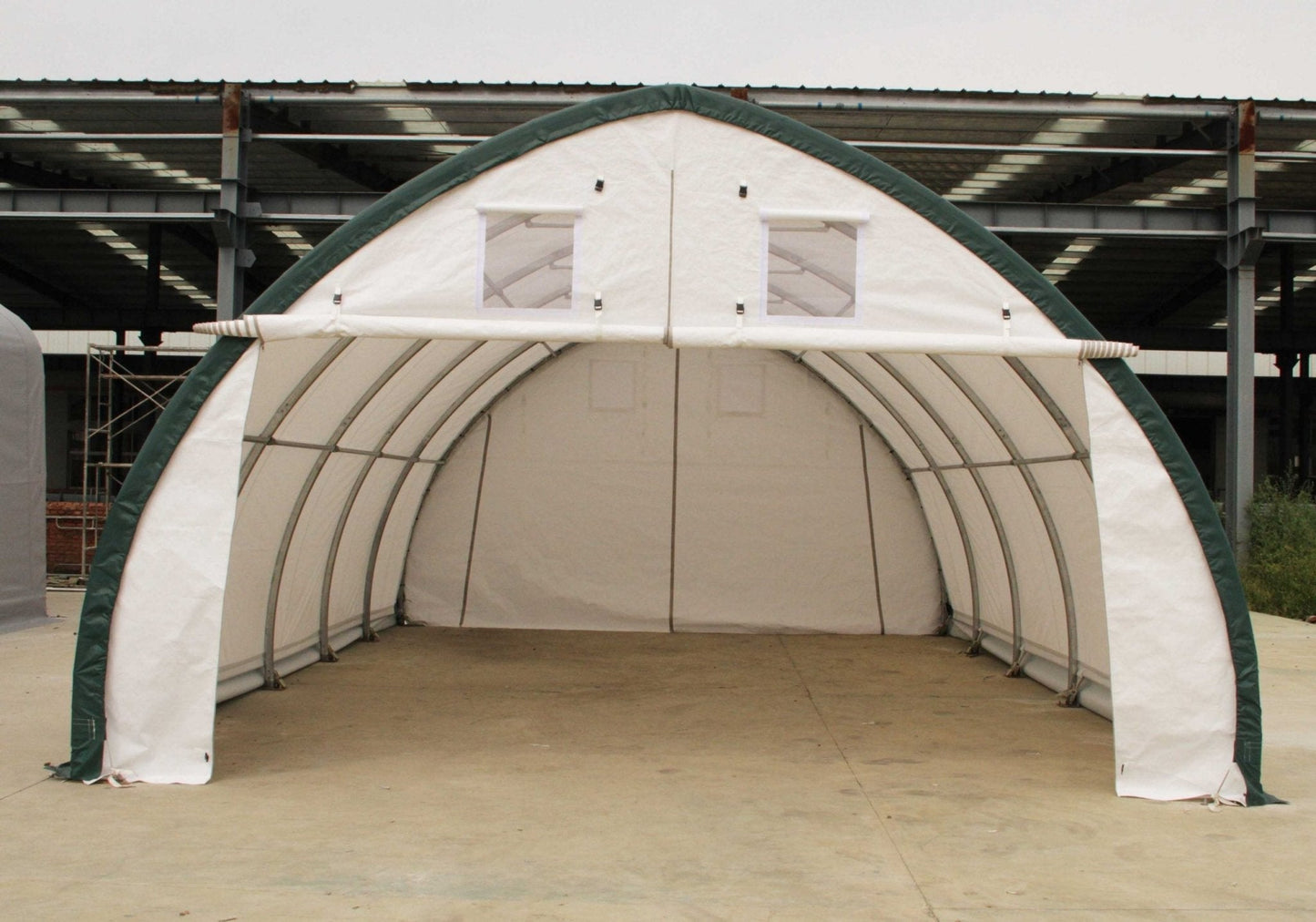 Industrial shelter with white PVC cover and front winch entry