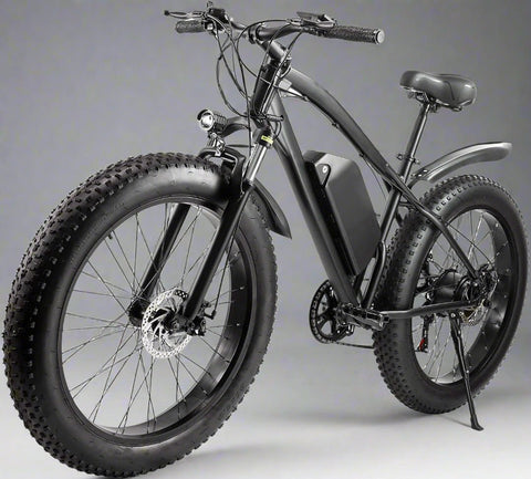Matte black electric fat tire mountain bike side profile

Rider using e-bike on snowy terrain

Close-up of 350W rear hub motor

Heavy-duty disc brakes on fat tire

Fat tire grip on sand and off-road trails