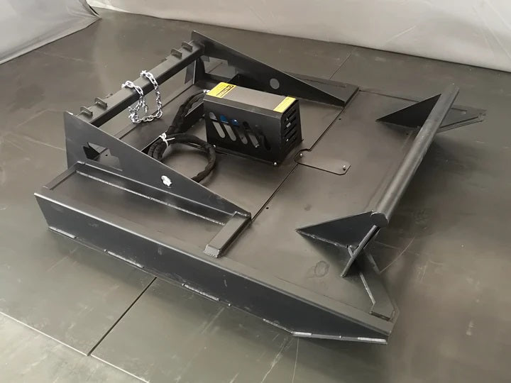 72 inch skid steer brush mower angled view

Underside of heavy-duty cutting blades

66 inch mower installed on skid steer

Skid steer clearing brush and saplings

Blade set and replacement part display