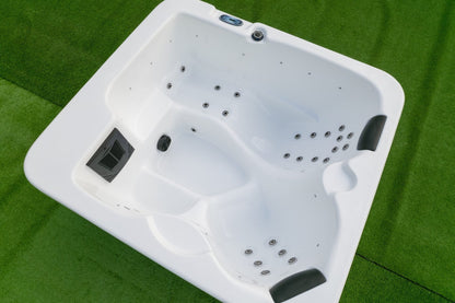 Front view of compact 3-person outdoor acrylic hot tub spa