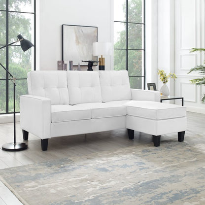 Reversible black sectional sofa in small apartment

Brown 3-seater L-shaped couch in modern room

White PU leather couch with chaise on right

Compact living room with small space sectional