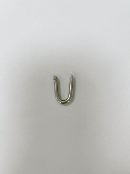 30-pound box of galvanized U-nail fence staples for wood posts
Heavy-duty wire fence staples with hot-dipped galvanized finish
Close-up of sharp tip U-shaped fencing nails for farm use
Fence hardware staples bulk packaging for wire and netting