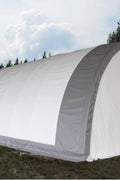 Exterior view of 30-foot heavy-duty PVC fabric truss storage building on farm site