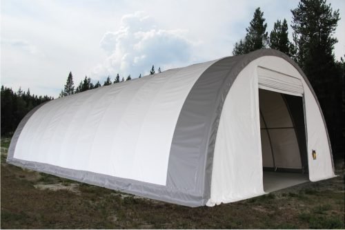 Exterior view of 30-foot heavy-duty PVC fabric truss storage building on farm site