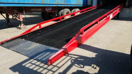 Red heavy-duty stationary dock ramp for forklift access