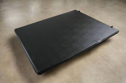 Tri-fold soft tonneau cover installed on Ford F-150 6.5 ft bed
Roll-up tonneau cover for 2009–2020 Ford truck bed
Weatherproof vinyl truck bed cover with clamp system
Tonneau cover folded up showing bed access
Side view of tri-fold tonneau cover on Ford F-150